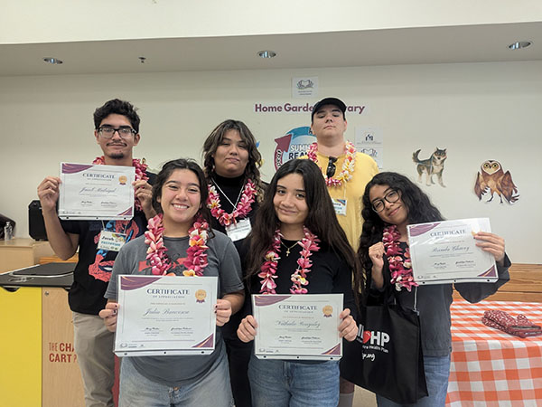 Teens receiving certificates.