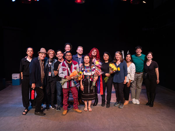 A large group photo of show performers, crew, and supporters.