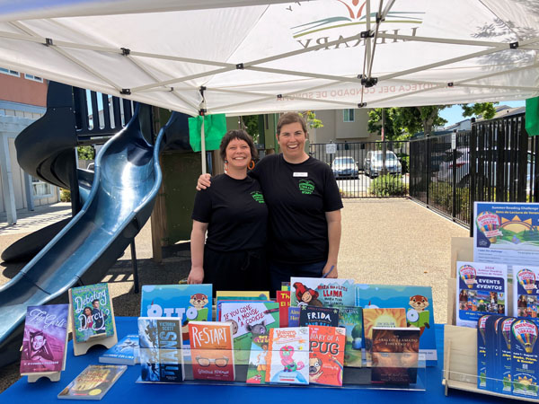 Outreach booth with staff.