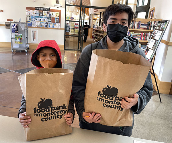 Youth receiving food distribution.