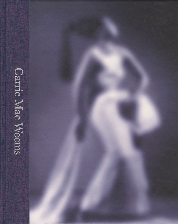 Book cover featuring a grainy photograph of a black woman in a white dress. Text down the left hand side of the image: Carrie Mae Weems.