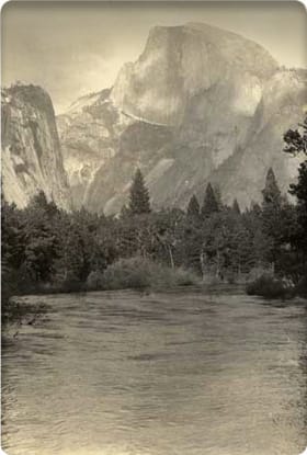 Sepia photo of Half Dome in background, Merced River in foreground.