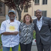 Booker T. Pannell, Debby Lynch and Gary Simon. Booker T. Pannell is holding his honorable mention certificate