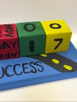 A board with the word 'Success'