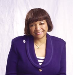 color portrait of Alice Huffman; she is shown wearing a purple jacket and white pants