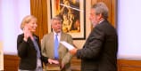 Rebecca Wendt is sworn into office by State Librarian Greg Lucas, accompanied by her partner, Joseph Vaughn.