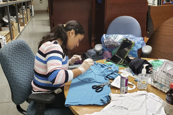 Library staff member or volunteer sewing cloth face masks. Photo credit to Monterey County Free Libraries.