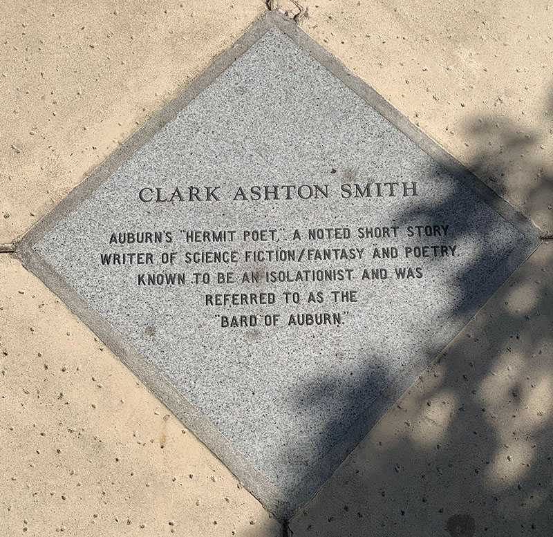 Color photo of a commemorative stone marker for Clark Ashton Smith.