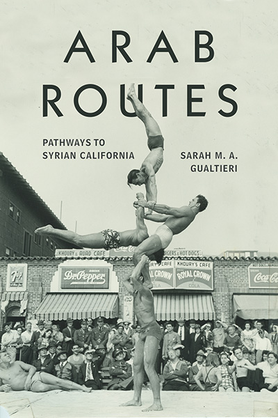 Cover of the book Arab routes showing the title and an image of four acrobats in the middle of a performance on the beach in front of the Khoury and Auad Café on Muscle Beach.