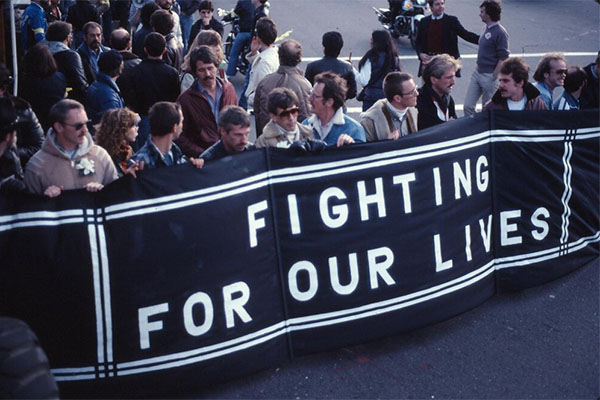 "Fighting for Our Lives" banner with crowd.