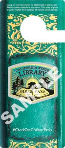 California State Library Parks Pass hangtag, modeled after a green book spine with gold stamping.