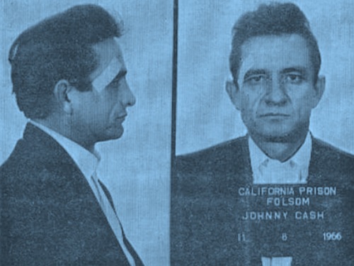 A blue-toned image of a booking photo mugshot featuring musician Johnny Cash.